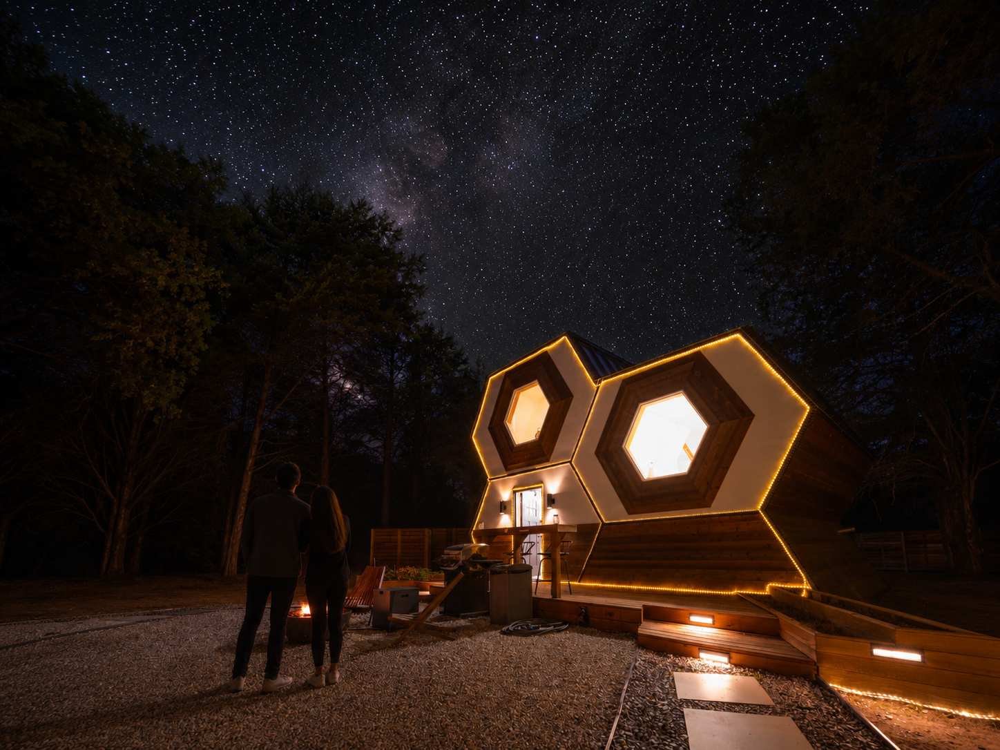 Couple stargazing at a luxury glamping getaway near Dallas Texas.